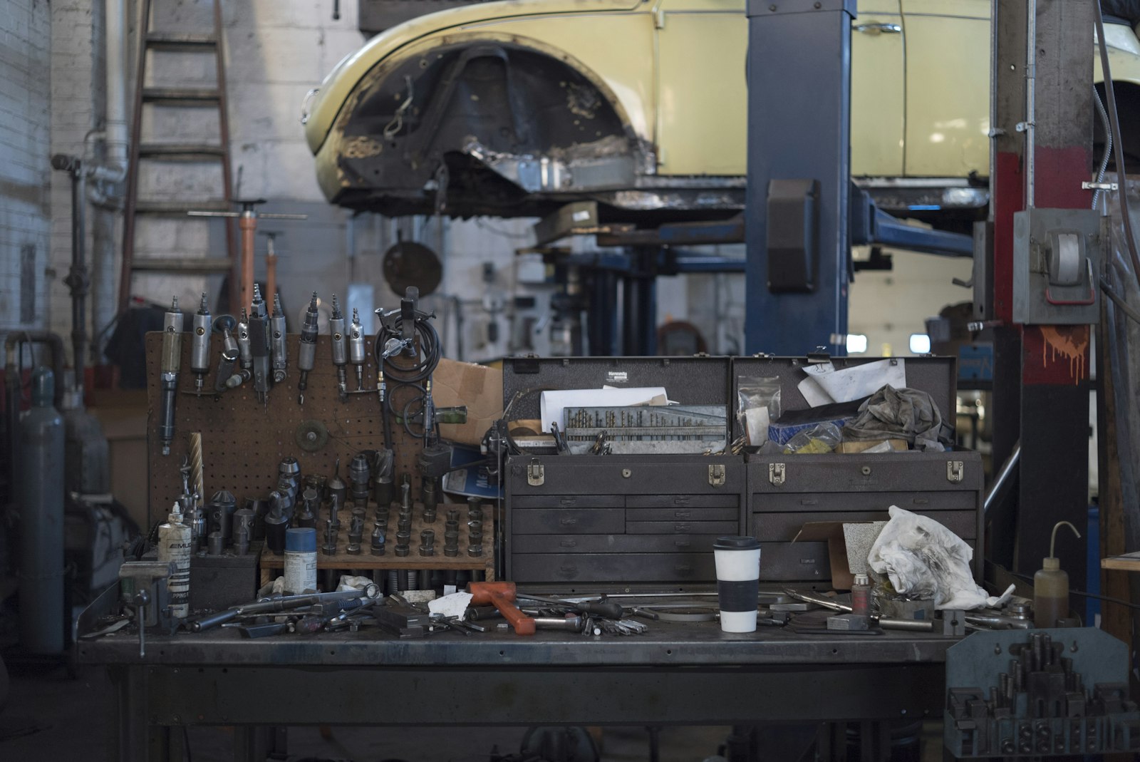 Air tools and machinist chests on a workshop bench